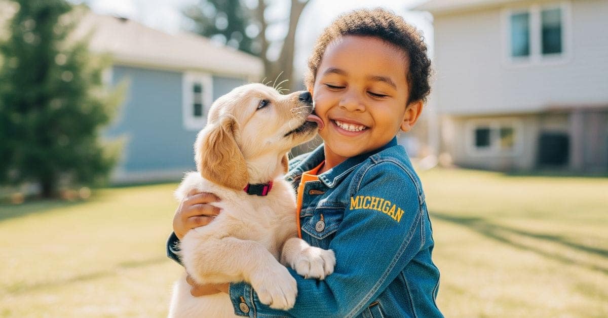 Adorable golden retriever puppy bonding with child in Michigan backyard, showcasing breed's gentle family-friendly temperament